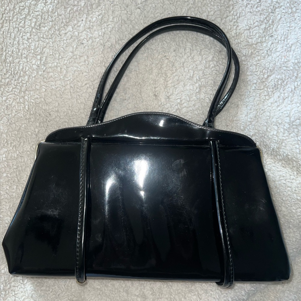 black purse with gold detailing